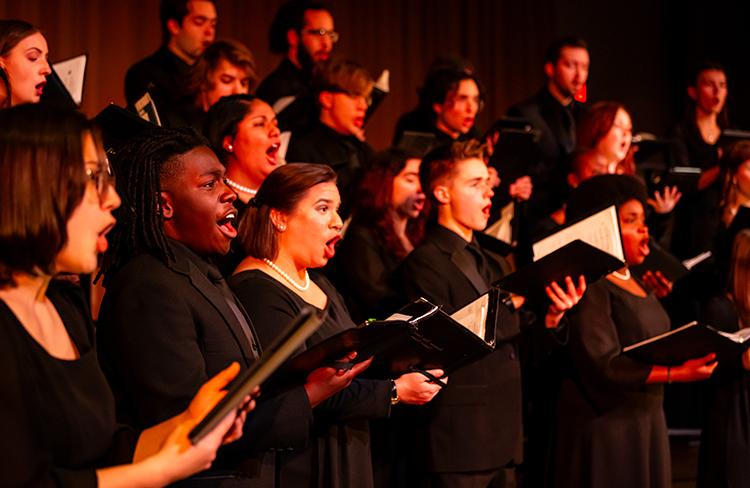 image of students singing on stage